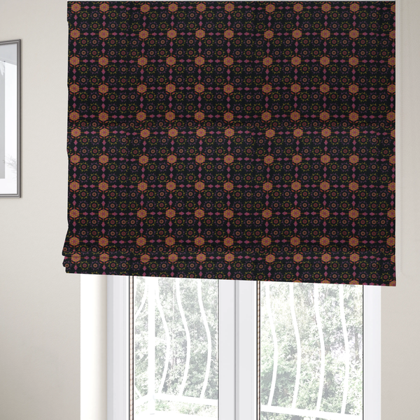 The fabric used to create these Roman blinds is an  intricate geometric fabric pattern featuring repeating mandala motifs, floral medallions, and ornate tiles in shades of pink, orange, yellow, and purple set against a dark black background.