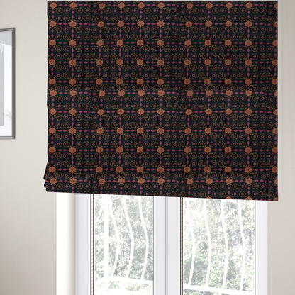 The fabric used to create these Roman blinds is an  intricate geometric fabric pattern featuring repeating mandala motifs, floral medallions, and ornate tiles in shades of pink, orange, yellow, and purple set against a dark black background.
