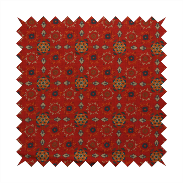 Traditional deep red block-print fabric featuring repeating geometric floral medallions.