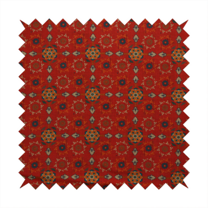 Traditional deep red block-print fabric featuring repeating geometric floral medallions.