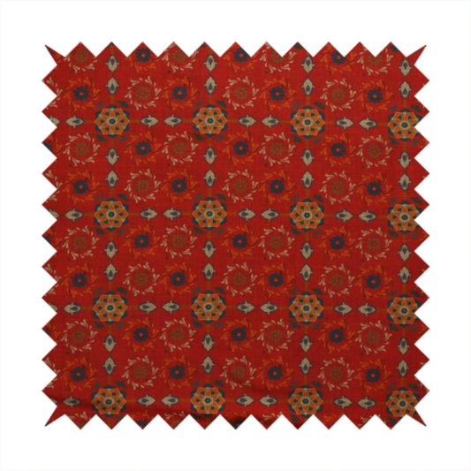 Traditional deep red block-print fabric featuring repeating geometric floral medallions.