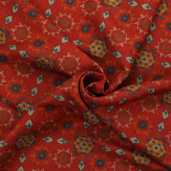 Traditional deep red block-print fabric featuring repeating geometric floral medallions.