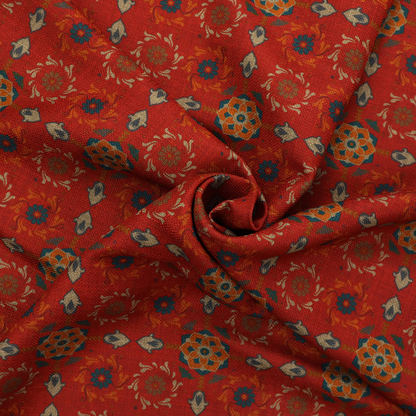 Traditional deep red block-print fabric featuring repeating geometric floral medallions.