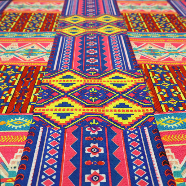 Seamless repeating geometric fabric pattern featuring vibrant tribal and Aztec-inspired patchwork bands in neon yellow, bright pink, cobalt blue, and turquoise.