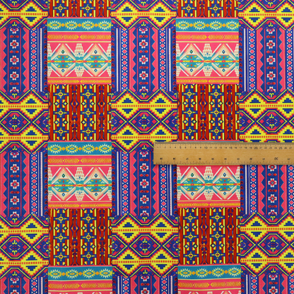 Seamless repeating geometric fabric pattern featuring vibrant tribal and Aztec-inspired patchwork bands in neon yellow, bright pink, cobalt blue, and turquoise.