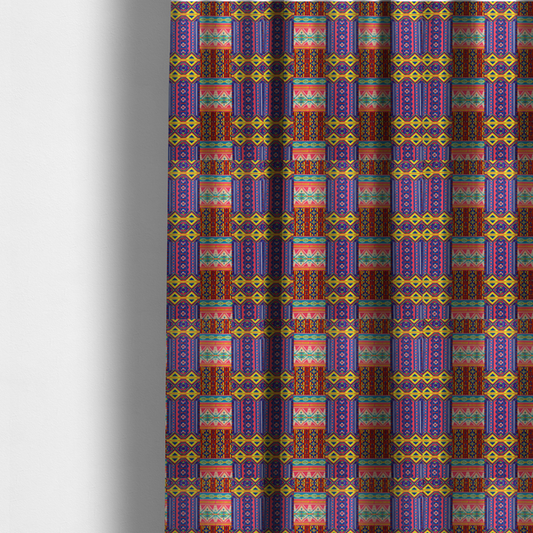 The fabric used to create these made-to-measure curtains is a seamless repeating geometric fabric pattern featuring vibrant tribal and Aztec-inspired patchwork bands in neon yellow, bright pink, cobalt blue, and turquoise.