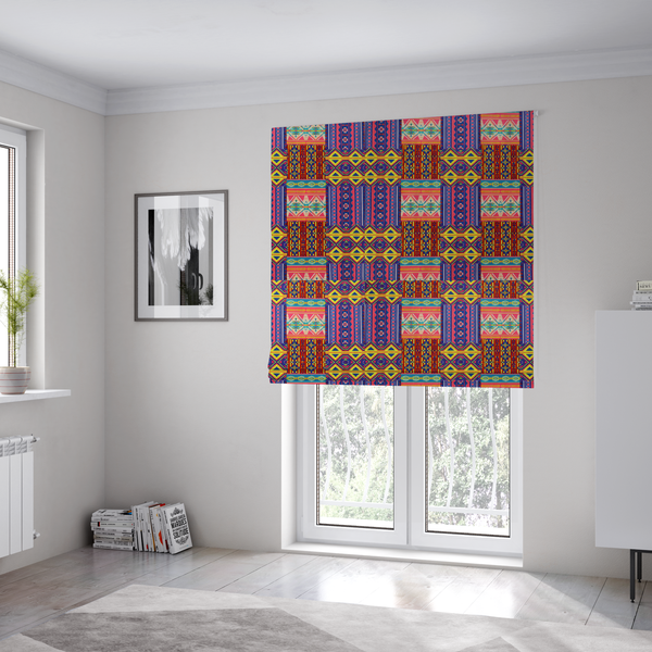 The fabric used to create these Roman blinds is a seamless repeating geometric fabric pattern featuring vibrant tribal and Aztec-inspired patchwork bands in neon yellow, bright pink, cobalt blue, and turquoise.
