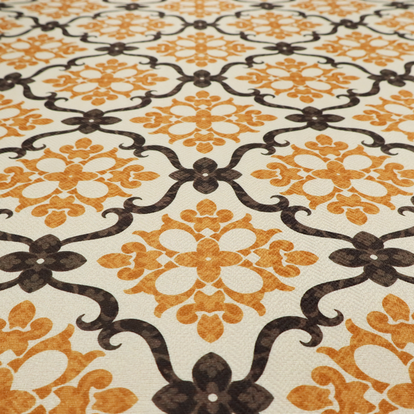 Mustard yellow and dark brown vintage ogee damask pattern fabric on an off-white background.