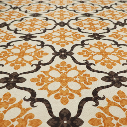 Mustard yellow and dark brown vintage ogee damask pattern fabric on an off-white background.