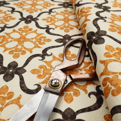 Mustard yellow and dark brown vintage ogee damask pattern fabric on an off-white background.