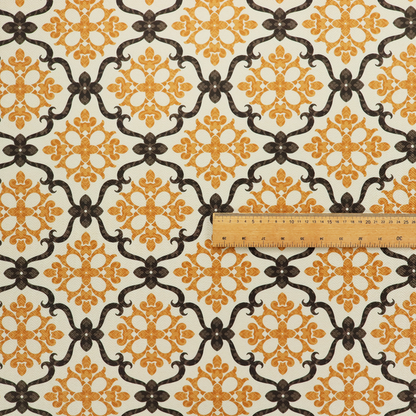 Mustard yellow and dark brown vintage ogee damask pattern fabric on an off-white background.
