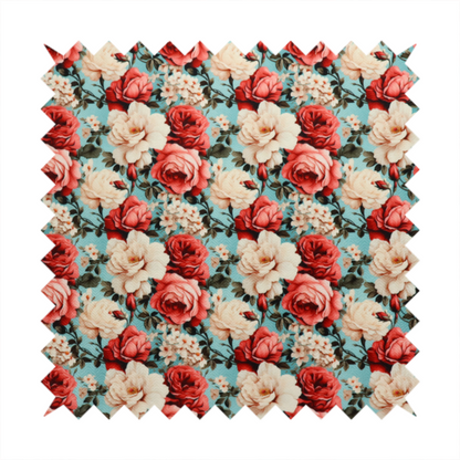 Vintage red, pink, and cream roses print fabric on a duck egg blue background.