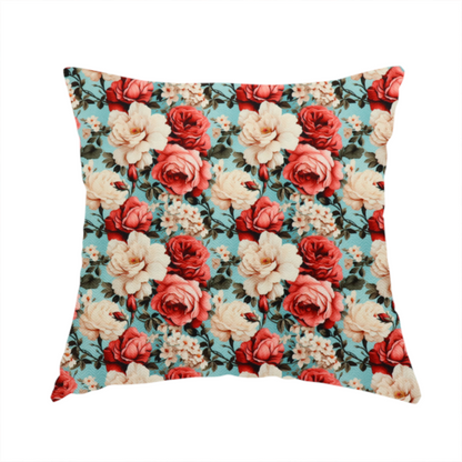 The fabric used to create this handmade cushion is a vintage red, pink, and cream roses print fabric on a duck egg blue background.