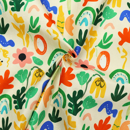 Playful Matisse-style abstract floral and botanical print fabric on an off-white background.