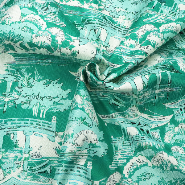 Jade green Chinoiseries fabric featuring an intricate pattern of traditional pagodas, bridges, and lush trees.