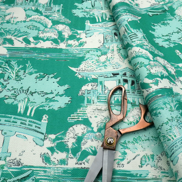 Jade green Chinoiseries fabric featuring an intricate pattern of traditional pagodas, bridges, and lush trees.
