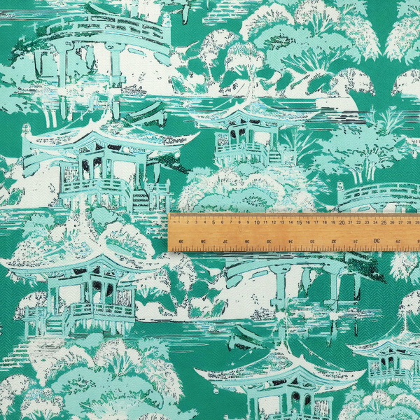 Jade green Chinoiseries fabric featuring an intricate pattern of traditional pagodas, bridges, and lush trees.