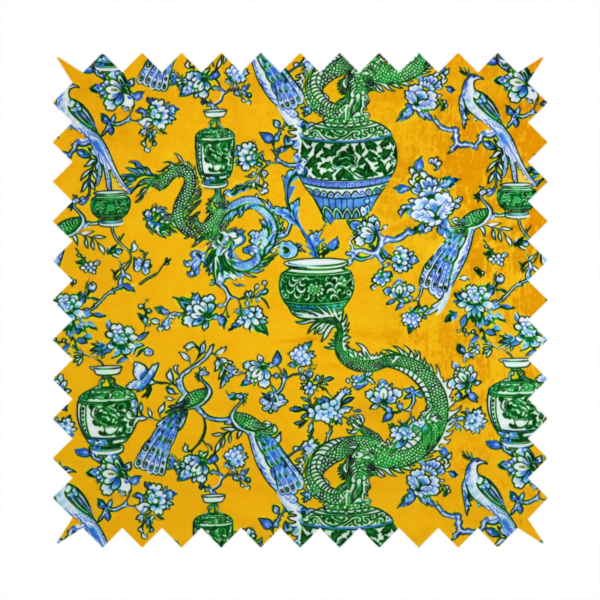 Seamless fabric pattern featuring Chinoiserie-style green dragons, blue and white peacocks, ornate vases, and floral branches against a vibrant mustard yellow background.