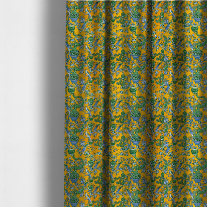 The fabric used to create these made-to-measure curtains is a seamless fabric pattern featuring Chinoiserie-style green dragons, blue and white peacocks, ornate vases, and floral branches against a vibrant mustard yellow background.