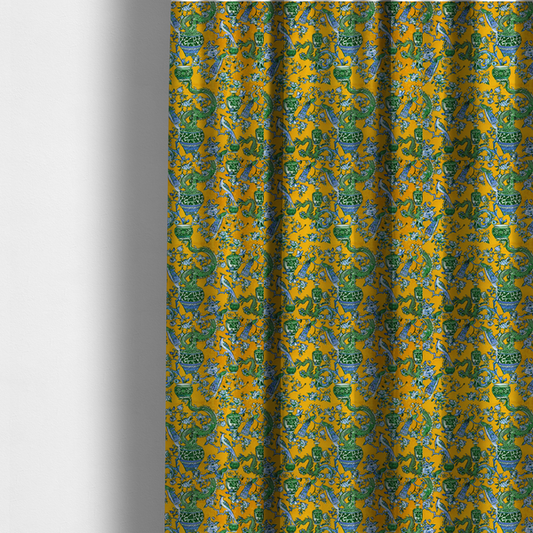 The fabric used to create these made-to-measure curtains is a seamless fabric pattern featuring Chinoiserie-style green dragons, blue and white peacocks, ornate vases, and floral branches against a vibrant mustard yellow background.