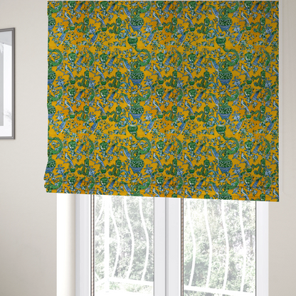 The fabric used to create these Roman blinds is a seamless fabric pattern featuring Chinoiserie-style green dragons, blue and white peacocks, ornate vases, and floral branches against a vibrant mustard yellow background.