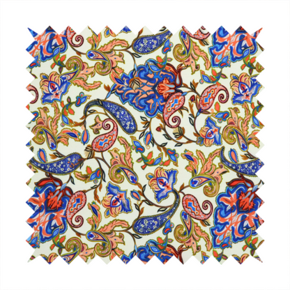 Cream-coloured fabric with an ornate repeating paisley pattern showcasing royal blue tear-drop motifs, vibrant coral and orange florals, and flowing leafy vines.   