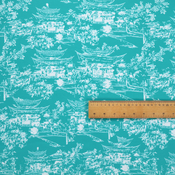 Bright turquoise fabric featuring a white Chinoiserie Toile pattern with pagoda structures, Asian landscape scenes, and botanical details.   