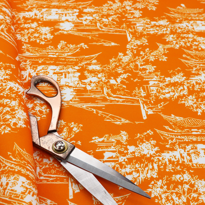 Vibrant orange fabric featuring a white Chinoiserie Toile pattern with pagodas, scenic Asian landscapes, and botanical details.   