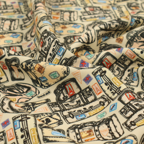 This fabric includes numerous variations of sketched travel bags, along with colourful stamps from different holiday destinations, on a natural background.