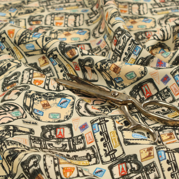 This fabric includes numerous variations of sketched travel bags, along with colourful stamps from different holiday destinations, on a natural background.