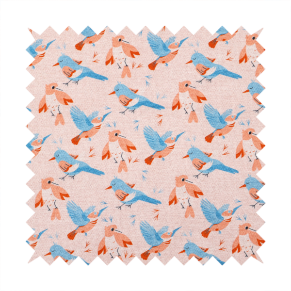 This fabric includes blue and pink birds in various positions on a soft pink background.