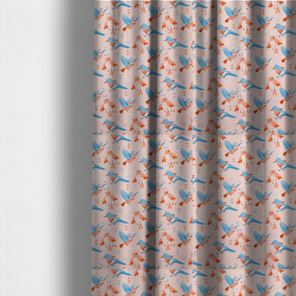 The fabric used to create these made-measure-curtains includes blue and pink birds in various positions on a soft pink background.