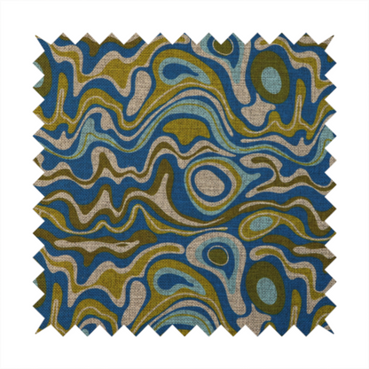 This fabric features different shades of green and beige swirls on a blue background.