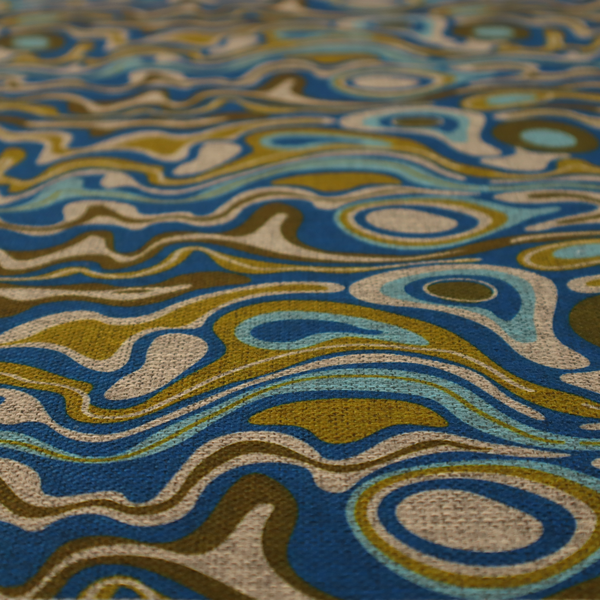 This fabric features different shades of green and beige swirls on a blue background.