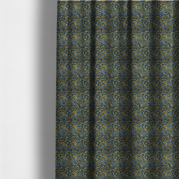 The fabric used to create these made-to-measure curtains, features different shades of green and beige swirls on a blue background.