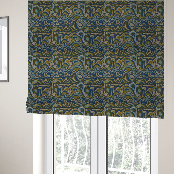 The fabric used to create these Roman blinds, features different shades of green and beige swirls on a blue background.