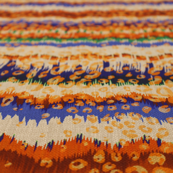 This fabric has a soft chevron pattern, the stripes are made up of blues, greens and oranges, whilst also featuring a leopard pattern.