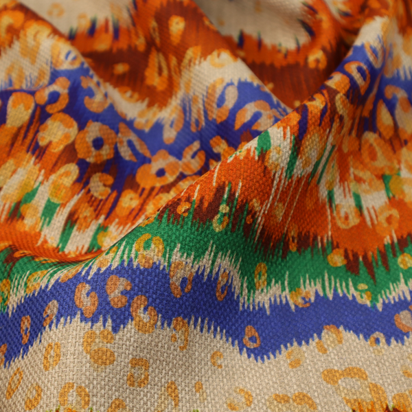This fabric has a soft chevron pattern, the stripes are made up of blues, greens and oranges, whilst also featuring a leopard pattern.