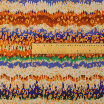 This fabric has a soft chevron pattern, the stripes are made up of blues, greens and oranges, whilst also featuring a leopard pattern.