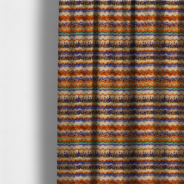 The fabric used to create these made-to-measure curtains has a soft chevron pattern, the stripes are made up of blues, greens and oranges, whilst also featuring a leopard pattern.