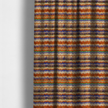 The fabric used to create these made-to-measure curtains has a soft chevron pattern, the stripes are made up of blues, greens and oranges, whilst also featuring a leopard pattern.