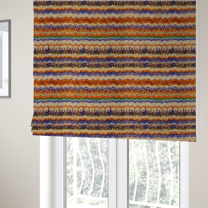 The fabric used to create these Roman blinds has a soft chevron pattern, the stripes are made up of blues, greens and oranges, whilst also featuring a leopard pattern.