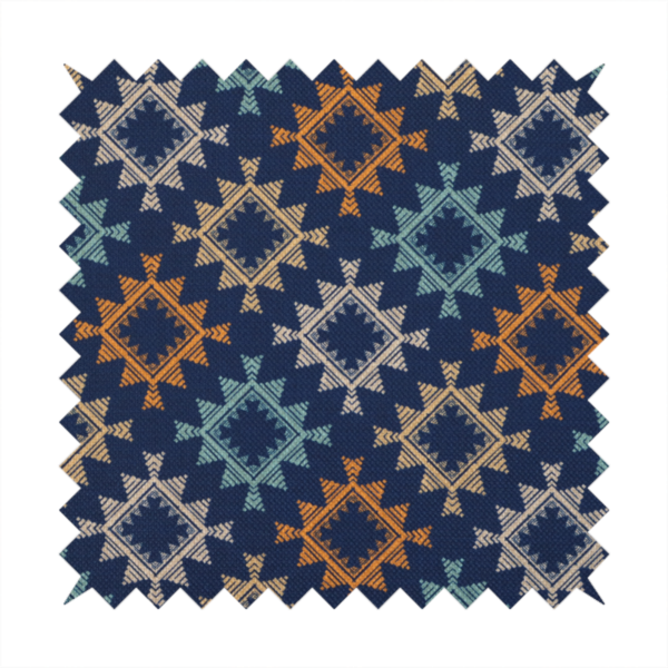 This fabric features repeated geometric shapes in blues, oranges and pinks on a navy blue background.