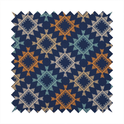 This fabric features repeated geometric shapes in blues, oranges and pinks on a navy blue background.