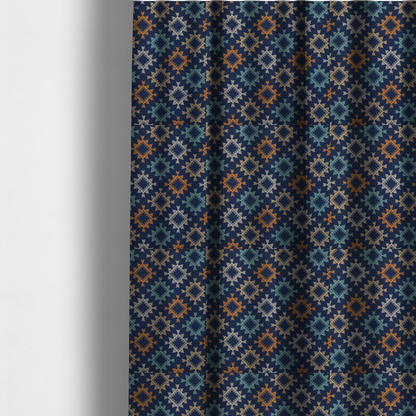 The fabric used to create these made-to-measure curtains, features repeated geometric shapes in blues, oranges and pinks on a navy blue background.