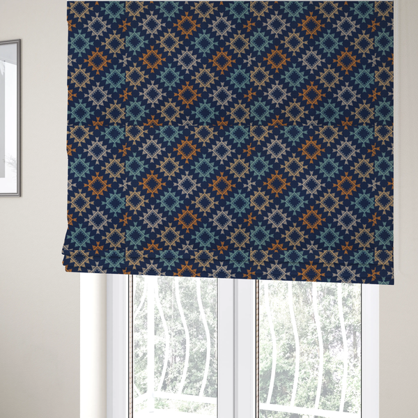 The fabric used to create these Roman blinds, features repeated geometric shapes in blues, oranges and pinks on a navy blue background.