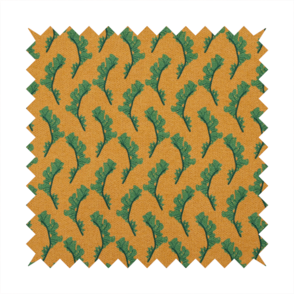 This fabric has a repeated green leaf/floral design on a warm yellow/golden background.