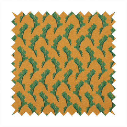 This fabric has a repeated green leaf/floral design on a warm yellow/golden background.