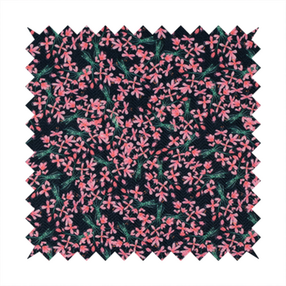 This fabric is saturated with pink floral bouquets on a deep green background.
