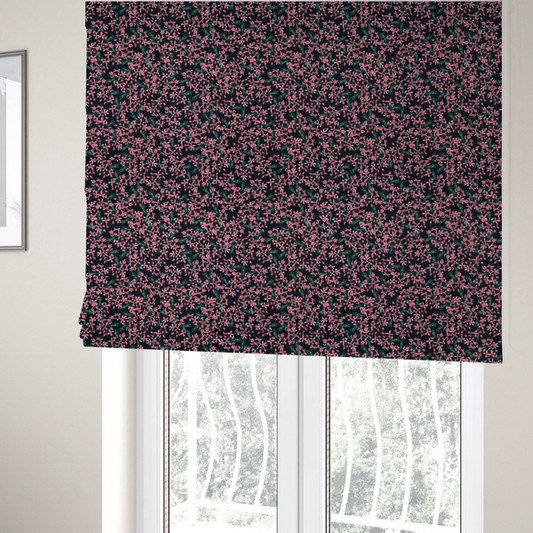 The fabric used to create these Roman blinds is saturated with pink floral bouquets on a deep green background.